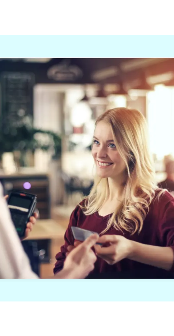 Customer paying at a café counter, representing FaciliPay loyalty and rewards.
