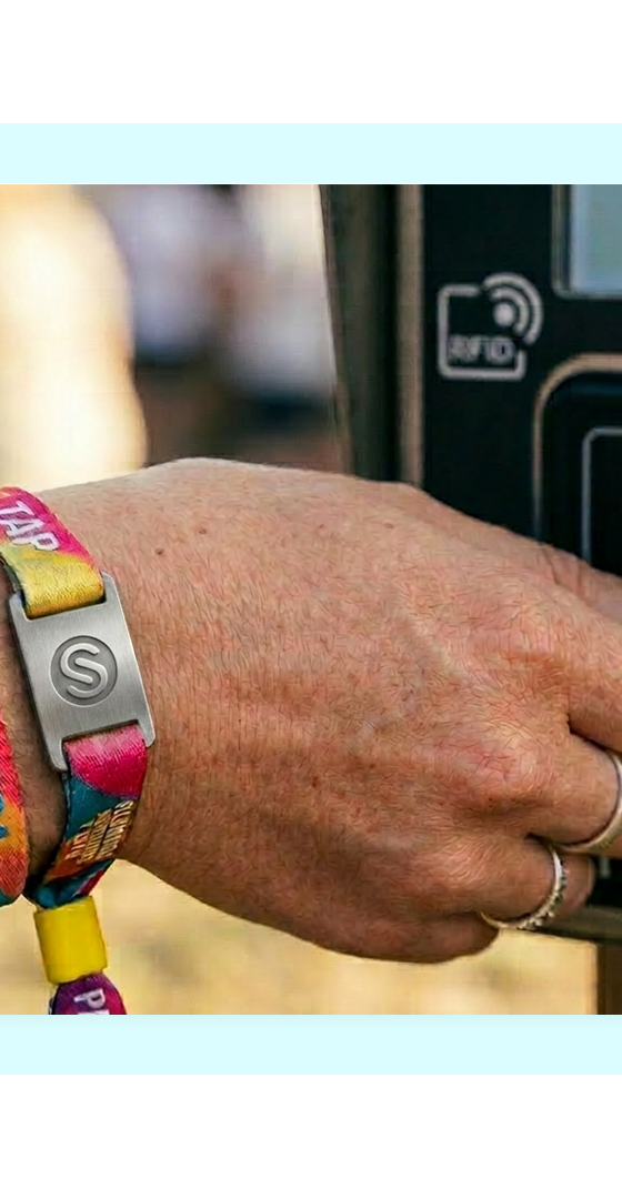 Guest making a cashless wristband wallet payment