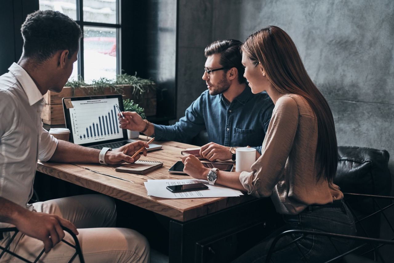 Business professionals analysing data and reports