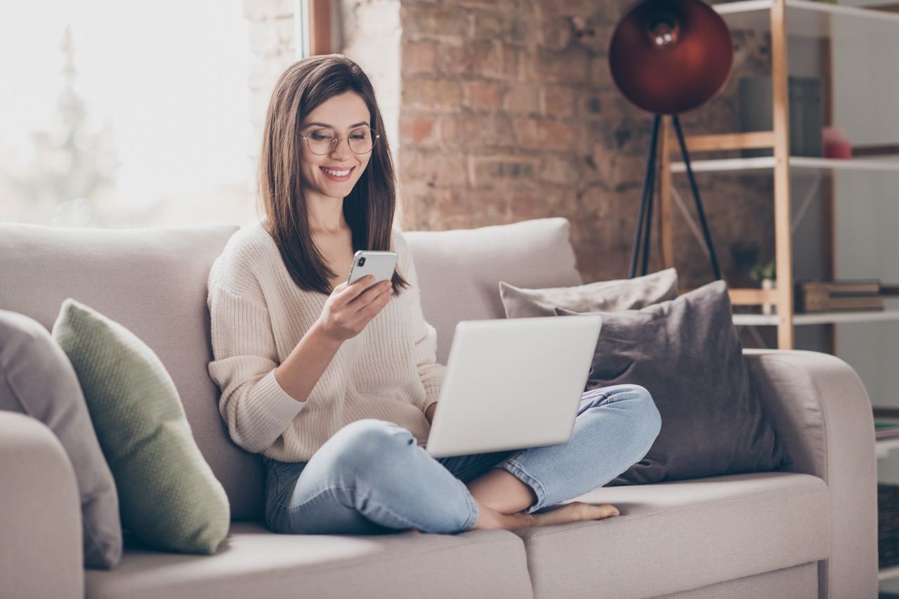 Woman using mobile phone for account management